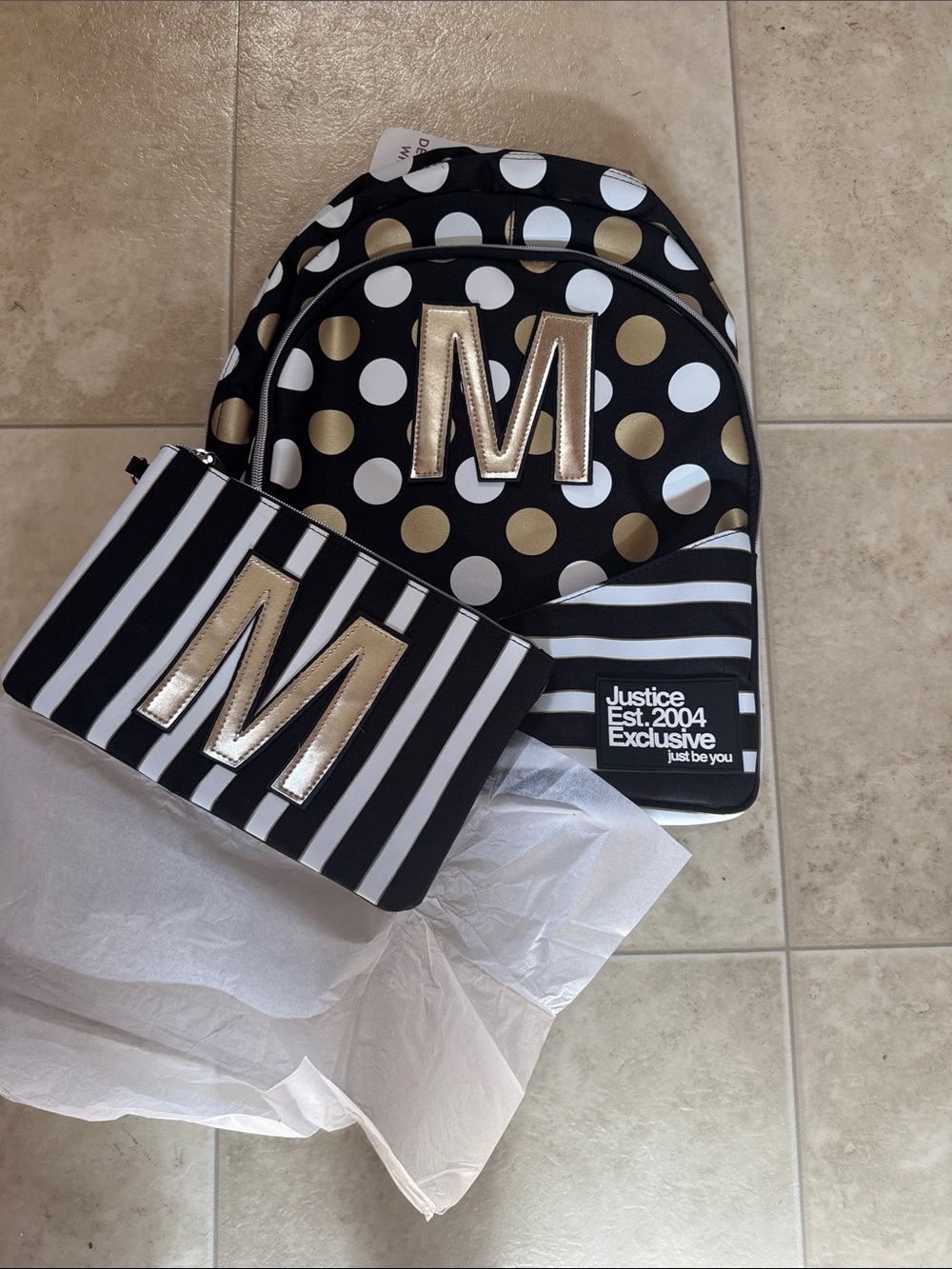Justice Gold & White polkadots backpack comes with a pouch at the front NWT.